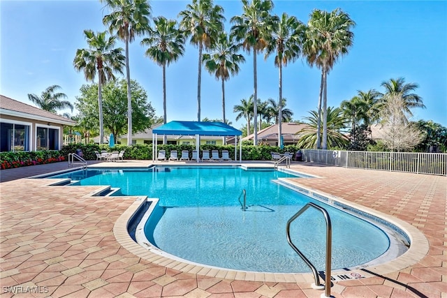 view of swimming pool with a patio area