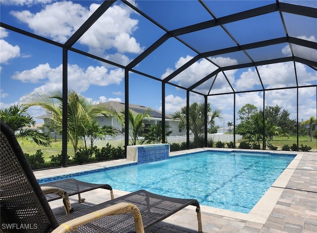 view of pool featuring a lanai, a patio area, and pool water feature