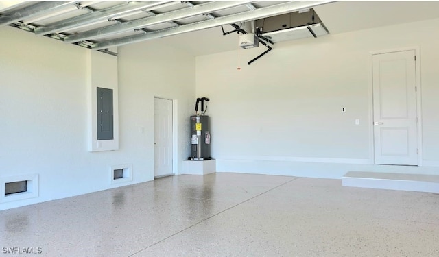 garage with electric panel, a garage door opener, and electric water heater