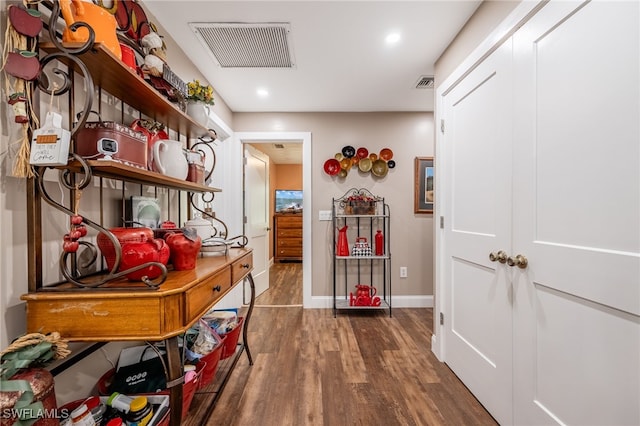 hallway featuring dark hardwood / wood-style floors