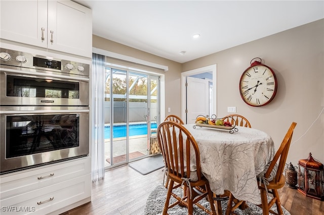 dining area featuring hardwood / wood-style flooring