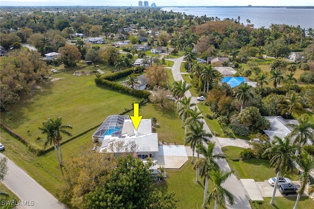 birds eye view of property with a water view