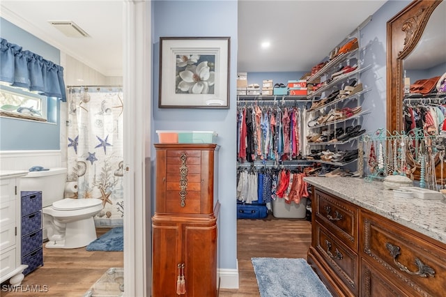 spacious closet featuring hardwood / wood-style flooring