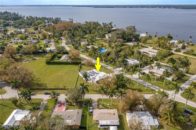 birds eye view of property with a water view