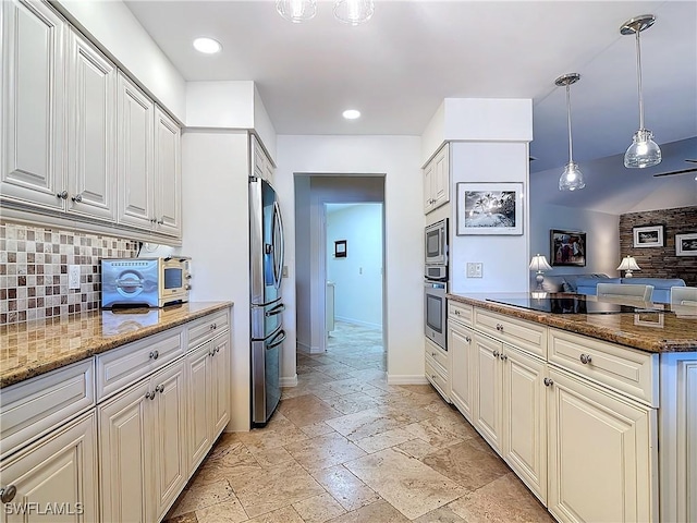 kitchen featuring stainless steel appliances, tasteful backsplash, hanging light fixtures, and dark stone counters