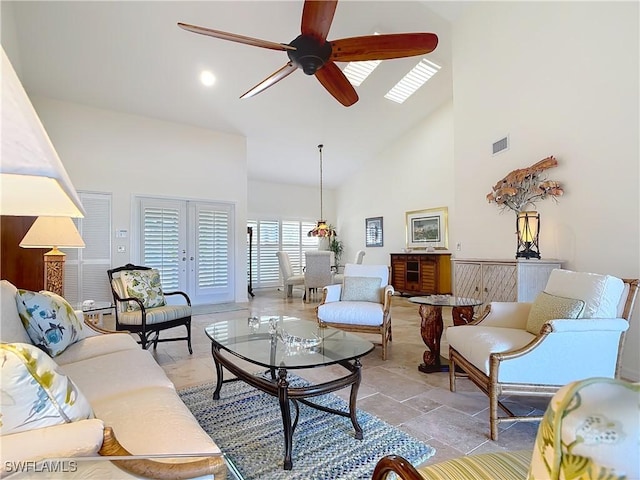 living room featuring high vaulted ceiling and ceiling fan