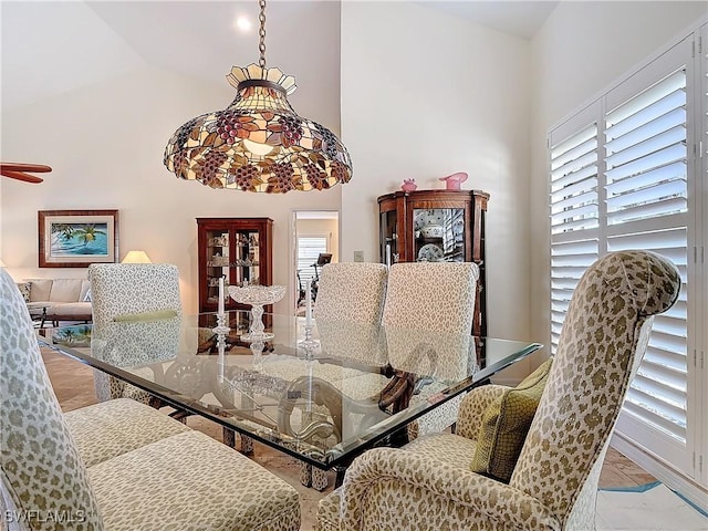 dining space with vaulted ceiling and plenty of natural light