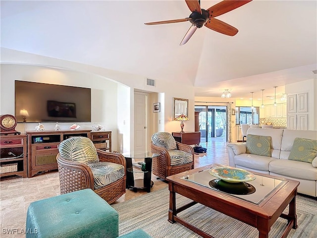 living room with high vaulted ceiling and ceiling fan