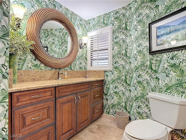 bathroom featuring vanity and toilet