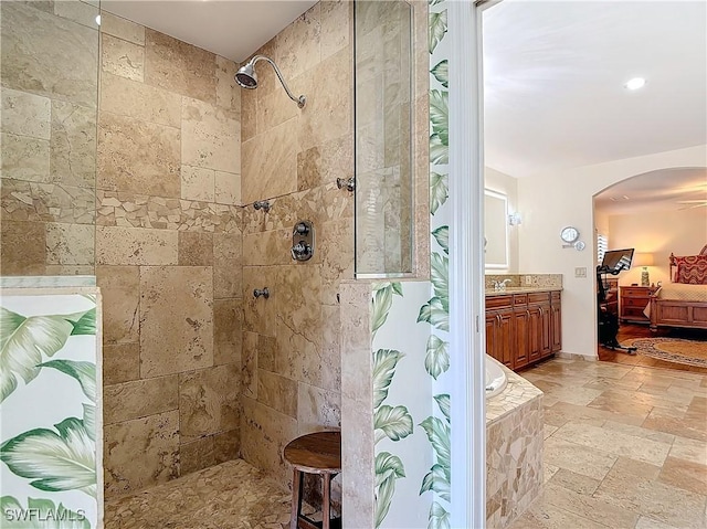 bathroom with vanity and independent shower and bath