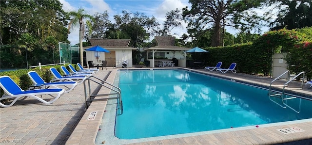 view of pool featuring a gazebo and a patio area