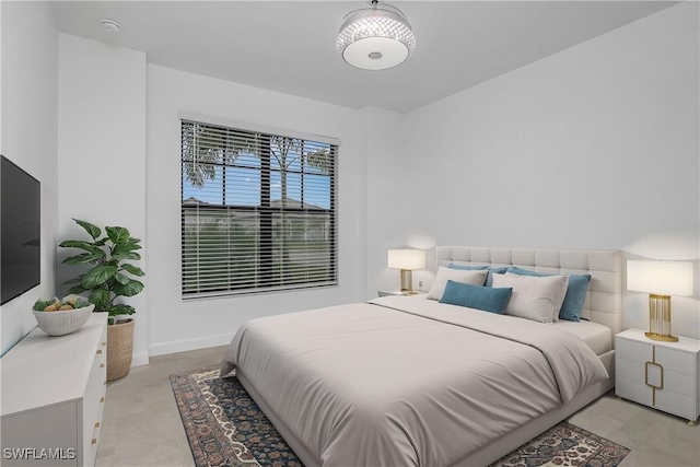 bedroom featuring baseboards