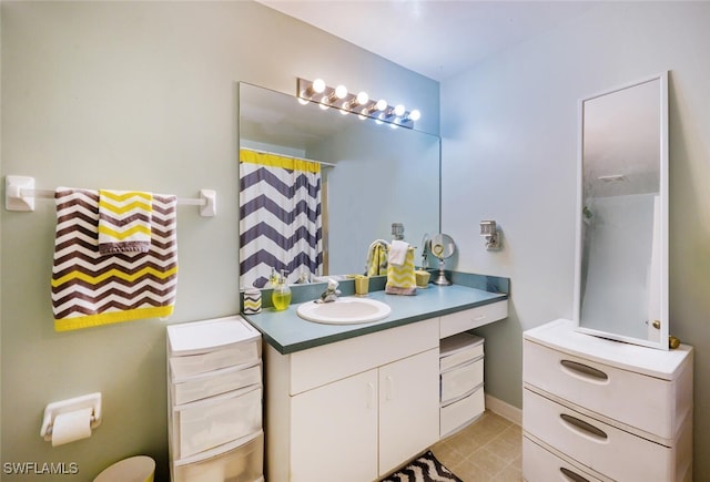 bathroom featuring curtained shower and vanity