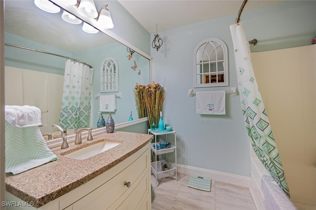 bathroom with tile patterned flooring, vanity, and shower / bath combo