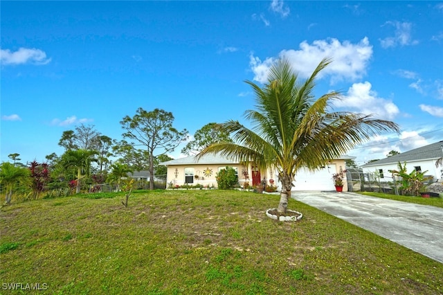 view of front of house with a front lawn and a garage