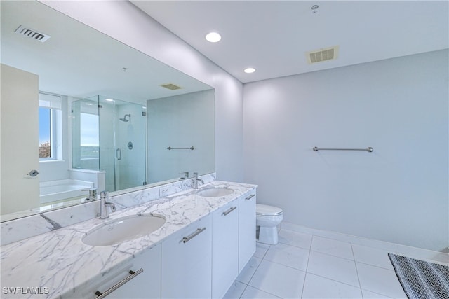 full bathroom with toilet, vanity, tile patterned flooring, and separate shower and tub