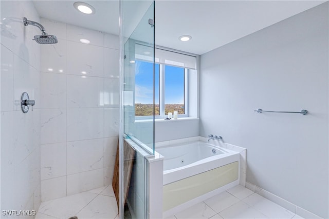 bathroom featuring tile patterned flooring and shower with separate bathtub