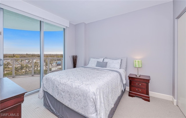 carpeted bedroom featuring access to outside