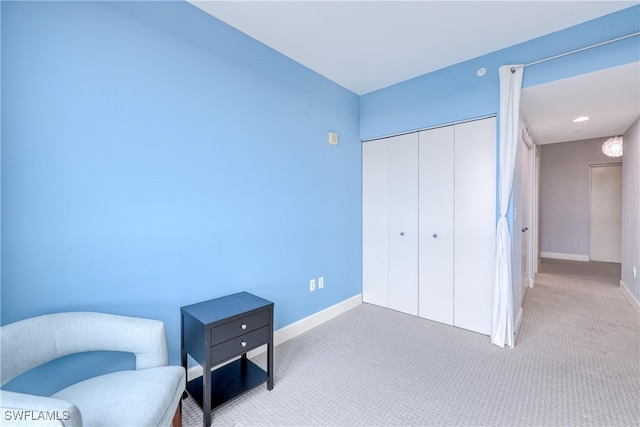 living area featuring light colored carpet