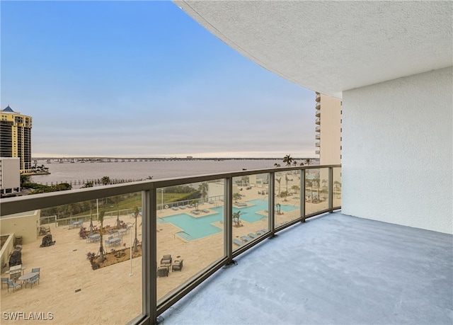 balcony featuring a water view