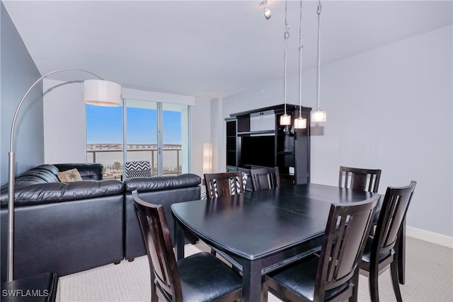 view of carpeted dining space