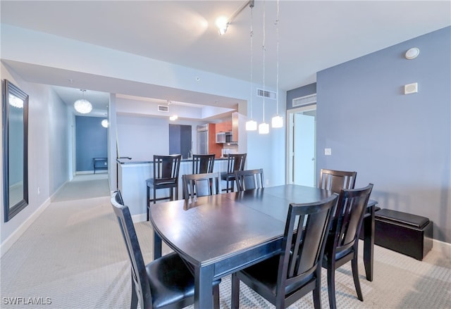 view of carpeted dining area