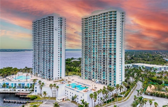 outdoor building at dusk featuring a water view