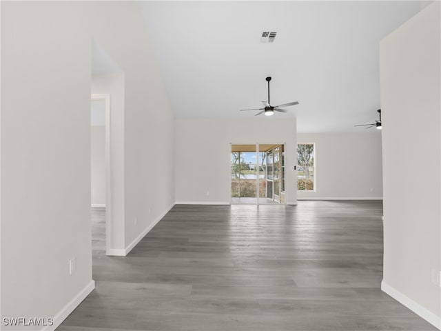 unfurnished living room with ceiling fan and hardwood / wood-style floors