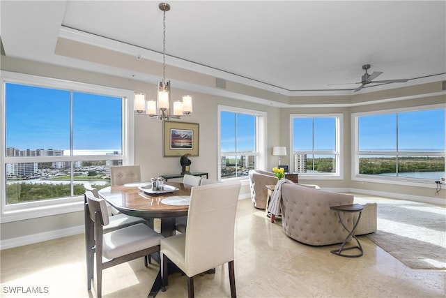 295 Grande Way Unit 1201, Naples, FL 34110 - dining room with plenty of natural light, a tray ceiling, and ornamental molding