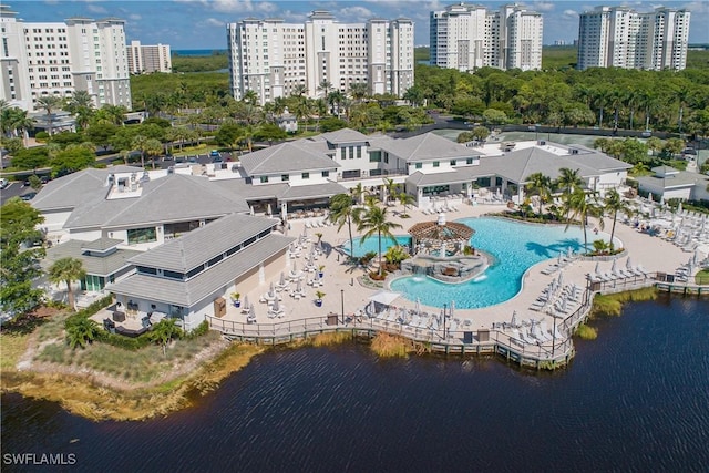 birds eye view of property with a water view