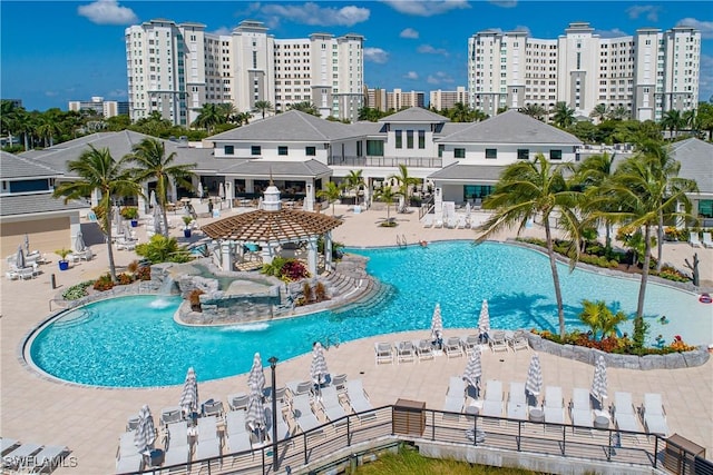 view of pool with a patio area and pool water feature