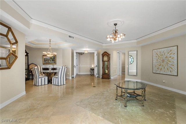 interior space with a raised ceiling, an inviting chandelier, and crown molding