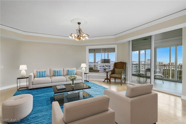 living room featuring ornamental molding and a notable chandelier