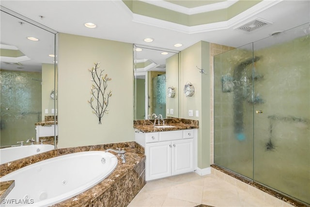 bathroom featuring tile patterned flooring, shower with separate bathtub, and vanity