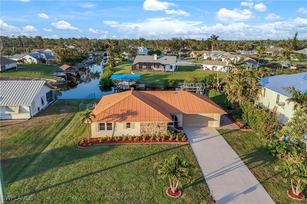 birds eye view of property with a water view