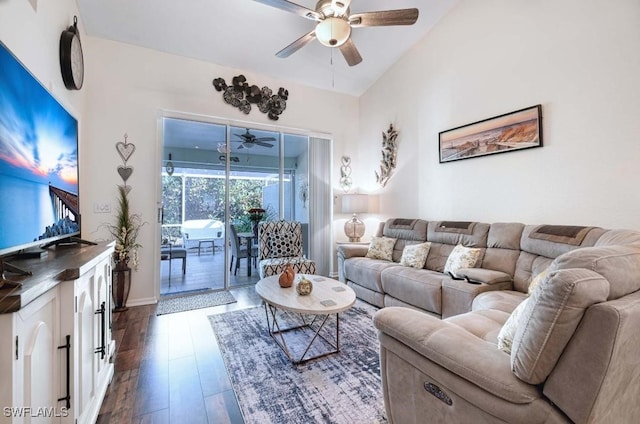 living room featuring ceiling fan, lofted ceiling, and dark hardwood / wood-style floors