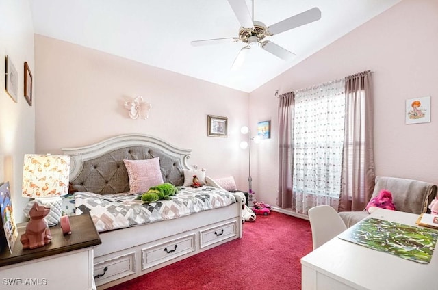 carpeted bedroom with ceiling fan and vaulted ceiling