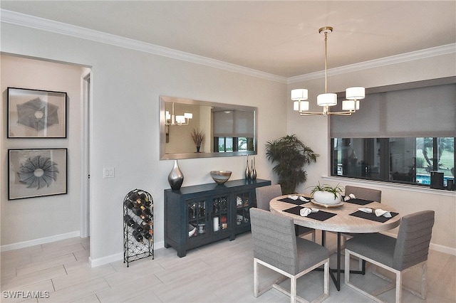 dining space featuring crown molding and an inviting chandelier