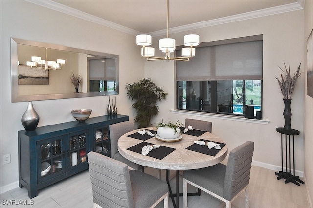 dining area featuring baseboards, crown molding, and an inviting chandelier