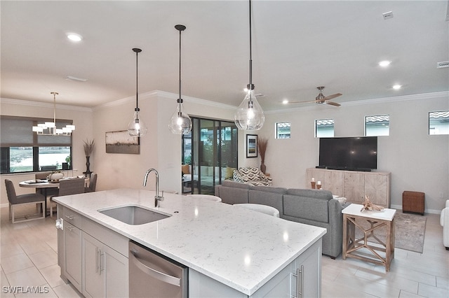 kitchen with light stone counters, an island with sink, a sink, stainless steel dishwasher, and open floor plan