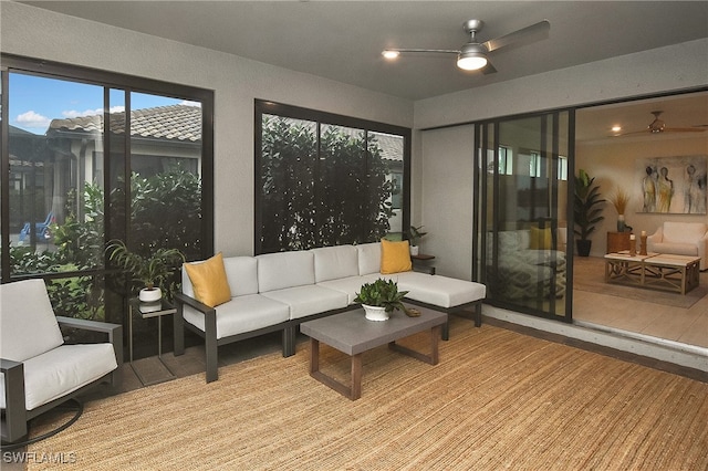 sunroom with ceiling fan