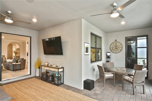 dining area with recessed lighting, arched walkways, and a ceiling fan