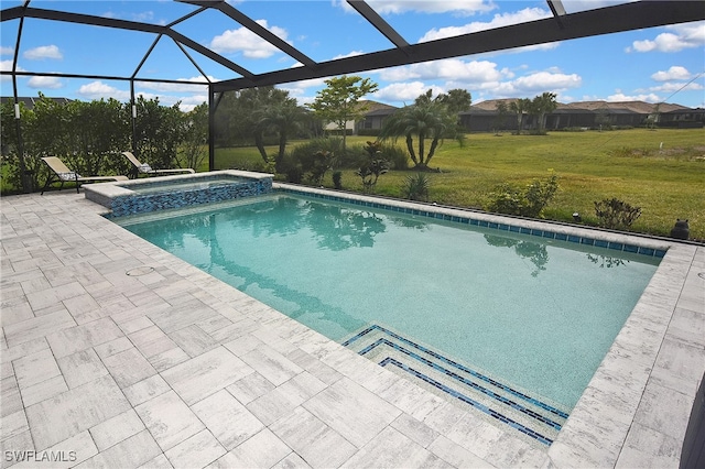 view of swimming pool featuring a lanai, a patio area, a yard, and an in ground hot tub