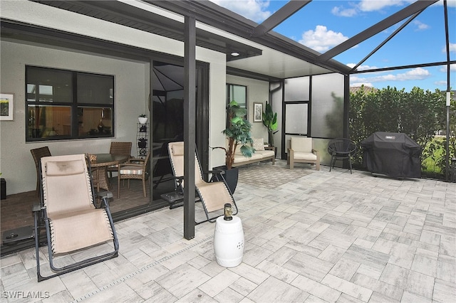 view of patio / terrace featuring a lanai and a grill