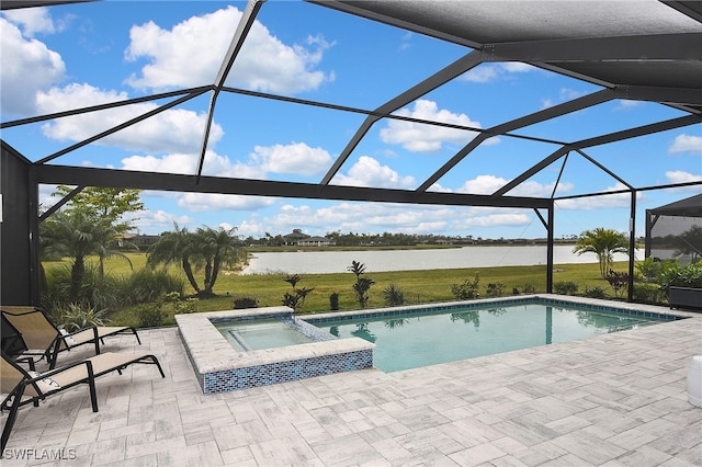 view of pool with glass enclosure, a patio area, an in ground hot tub, and a water view