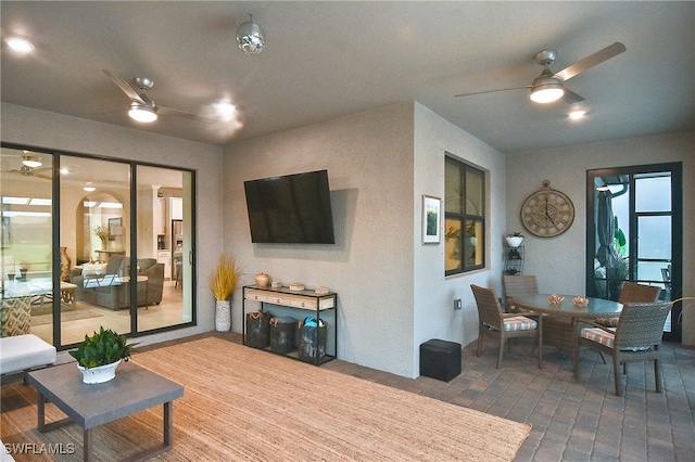 living area featuring ceiling fan