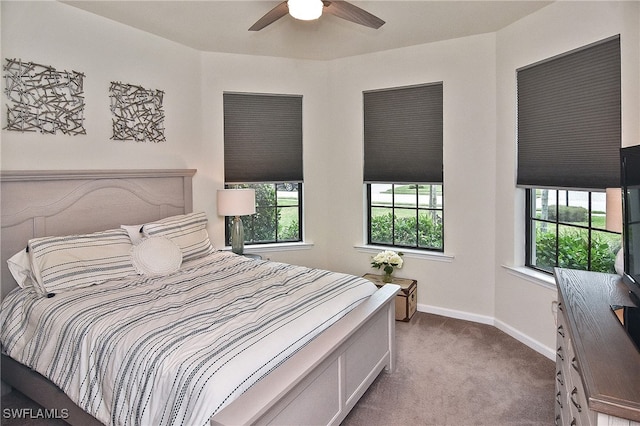 bedroom featuring ceiling fan and light carpet