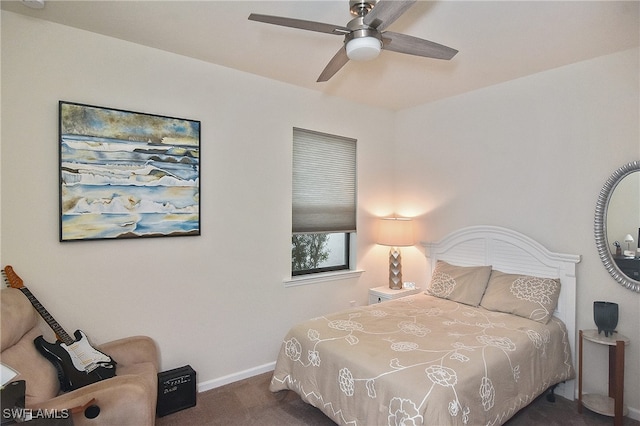 bedroom featuring ceiling fan, baseboards, and dark colored carpet