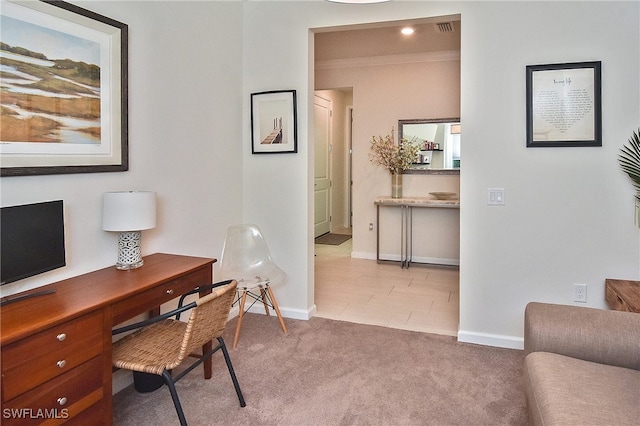 carpeted office featuring visible vents, crown molding, and baseboards