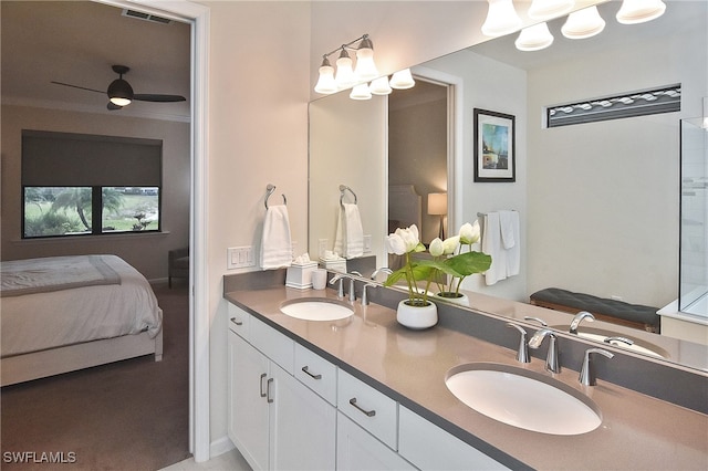 bathroom featuring double vanity, visible vents, ensuite bathroom, and a sink